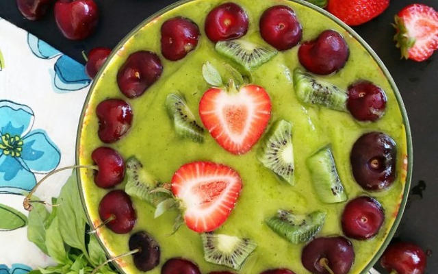 Green Smoothie Bowl with Cherries and Strawberry
